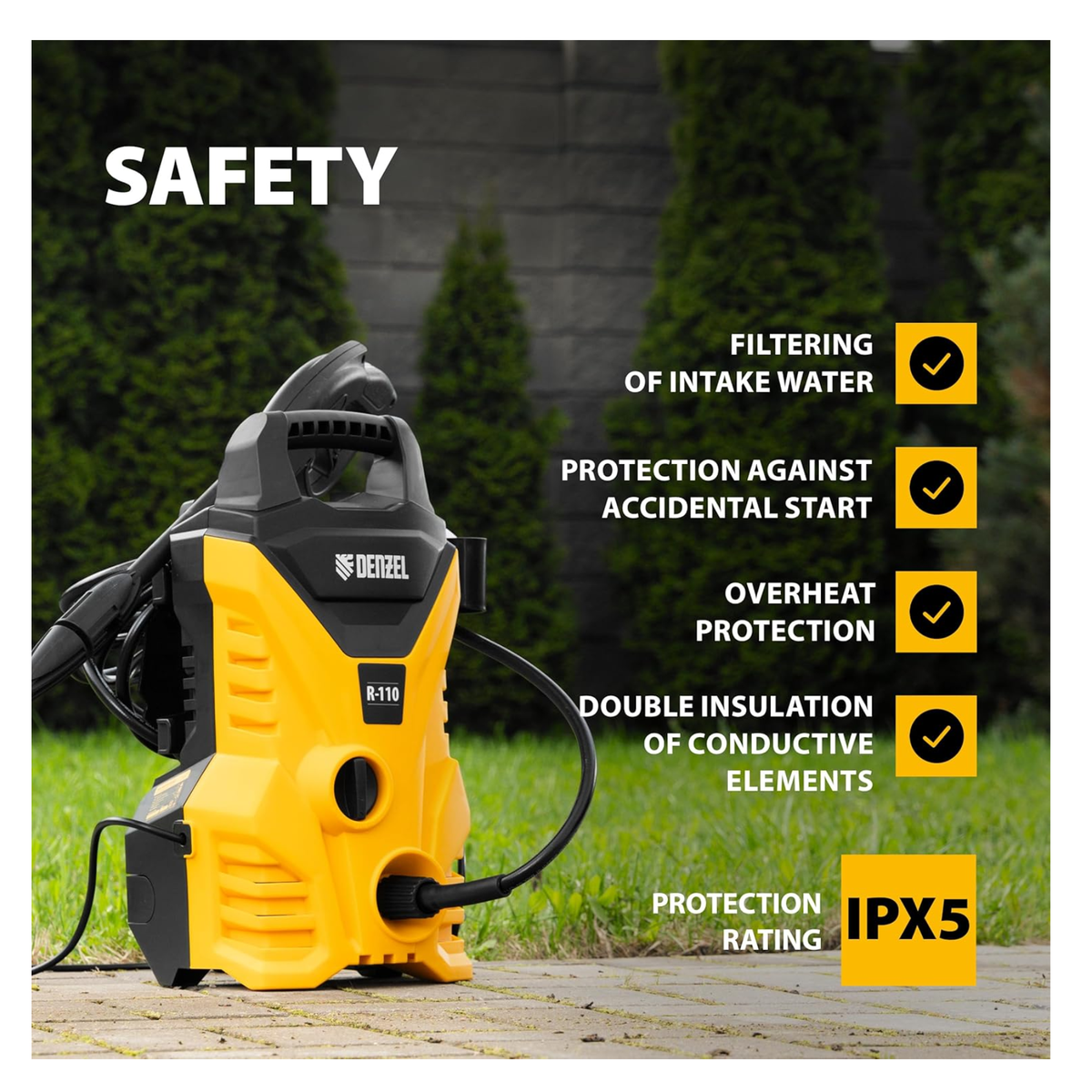 Yellow and black pressure washer with safety features listed on a grassy background