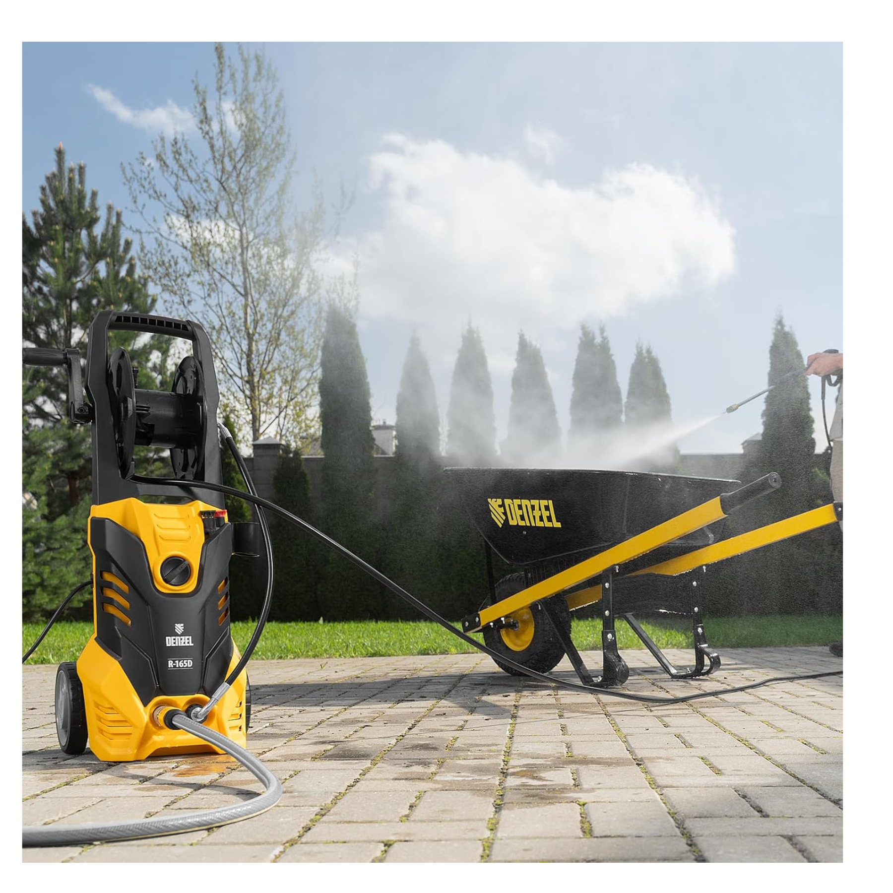 DeWalt pressure washer cleaning a black wheelbarrow outdoors.