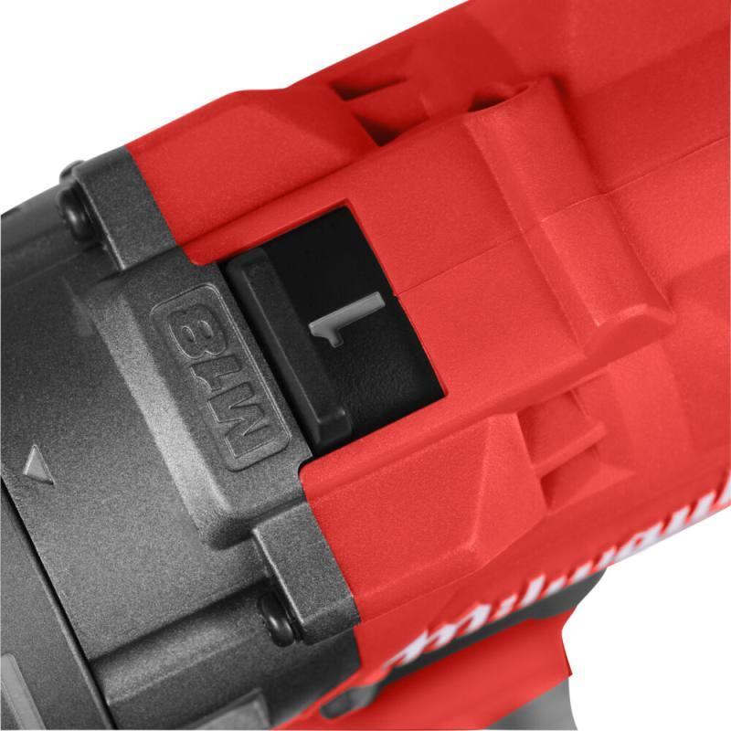 Close-up of a red and black power tool with 'Milwaukee' branding.