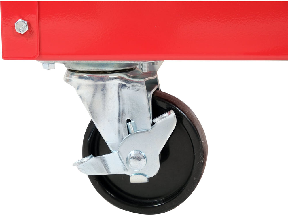 Close-up of a red platform truck with a black wheel on a white background