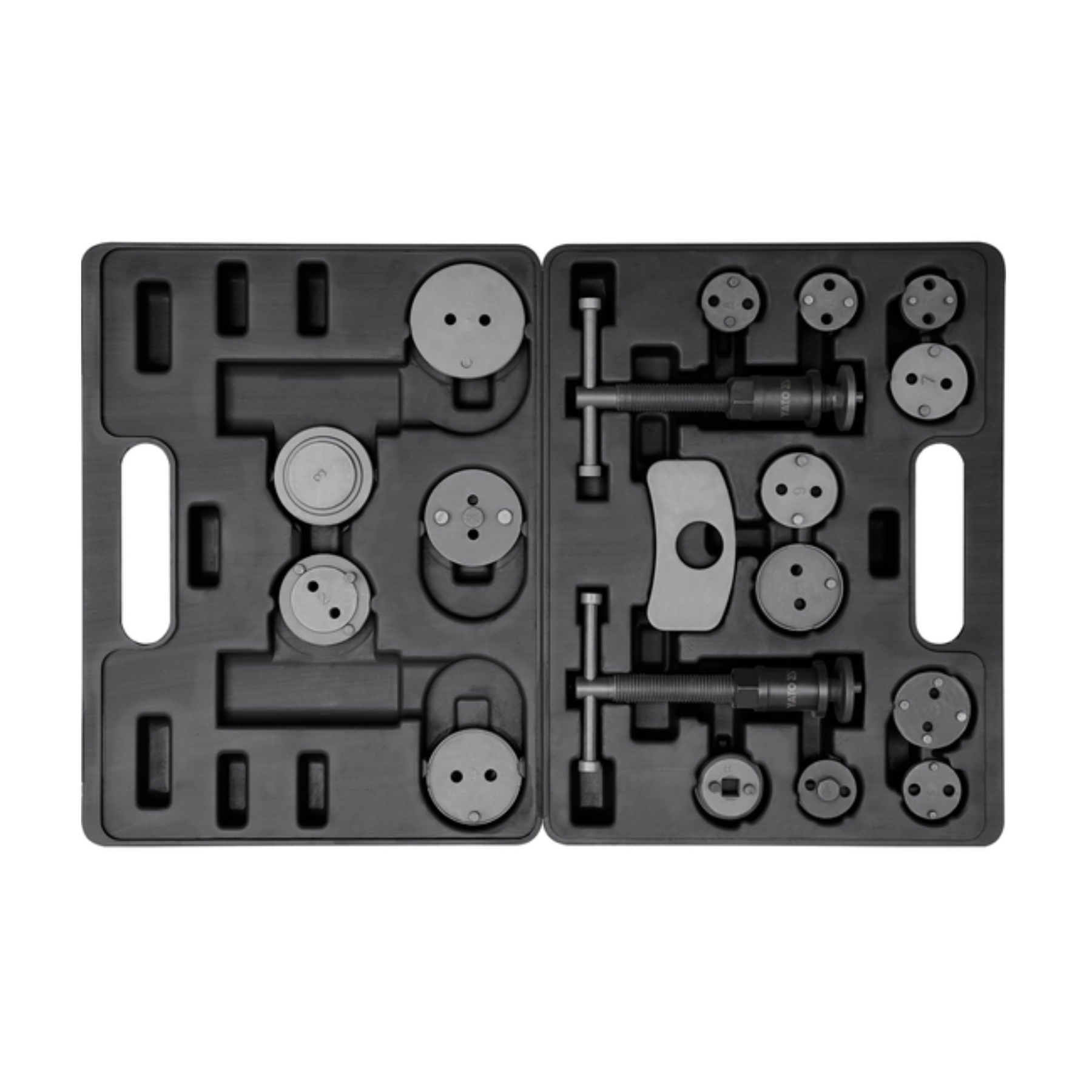 Set of mechanical components on a black tray with a white background