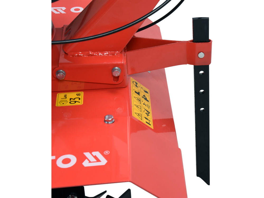 Red agricultural tool with a black handle on a white background
