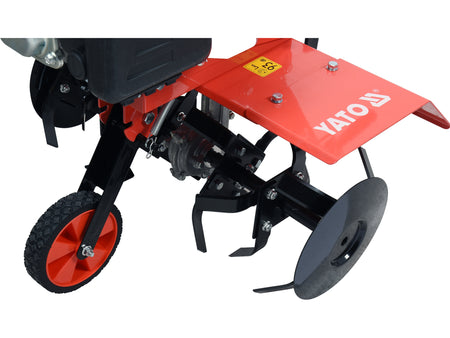 Garden tiller with red and black design on a white background