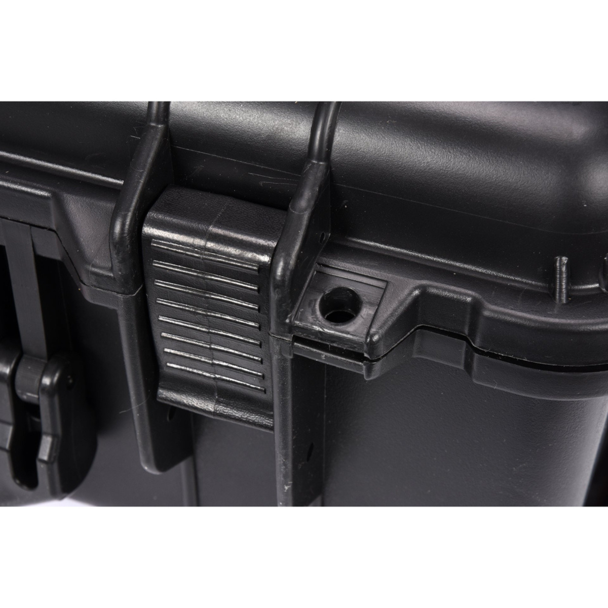 Close-up of a black plastic latch on a container