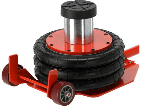 Red and black tire jack on a white background