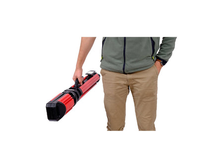 Person holding a red and black tool case on a white background