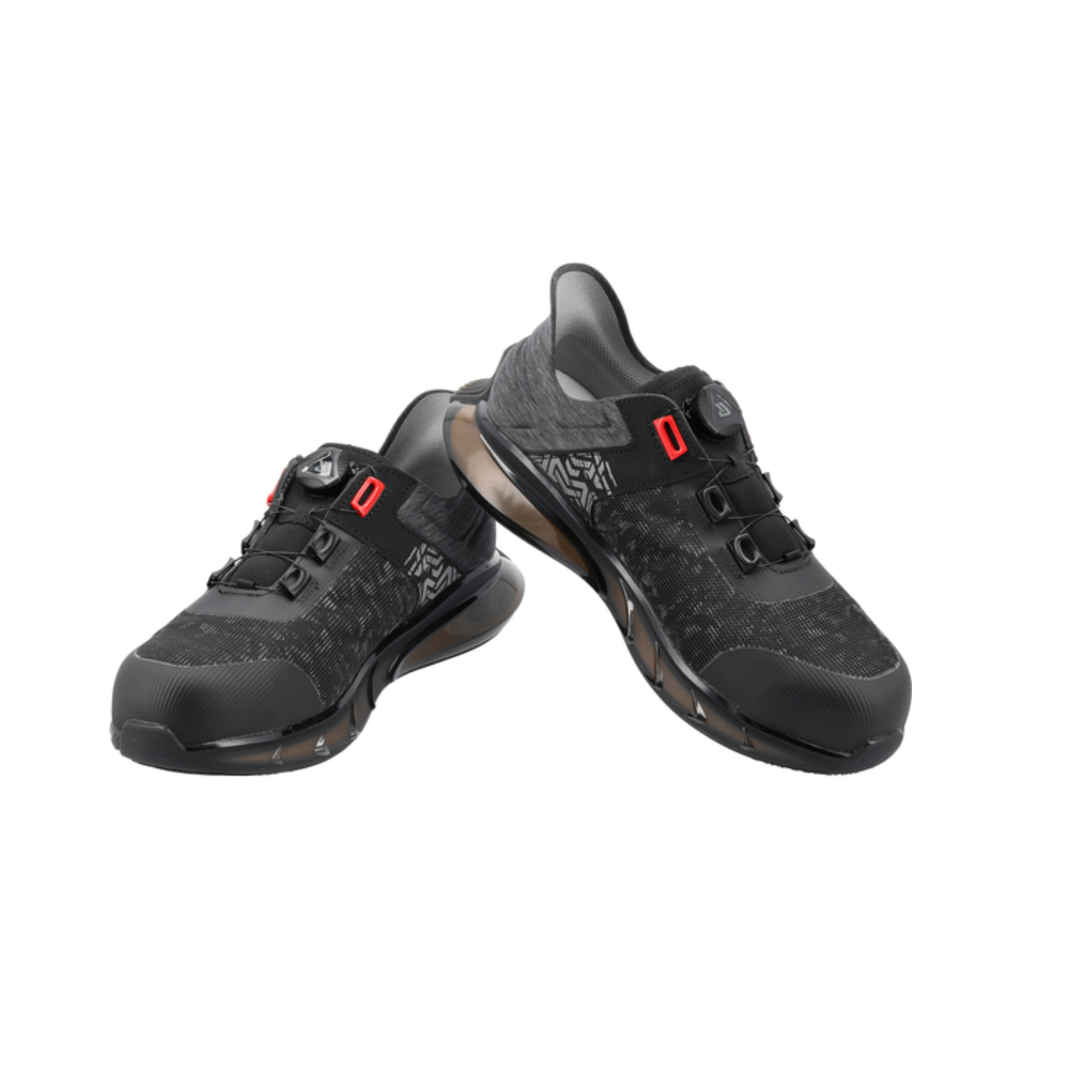Pair of black athletic shoes with red accents on a white background