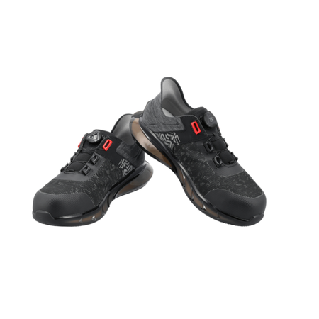 Pair of black athletic shoes with red accents on a white background