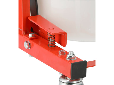 Red metal clamp with springs and screws on a white background