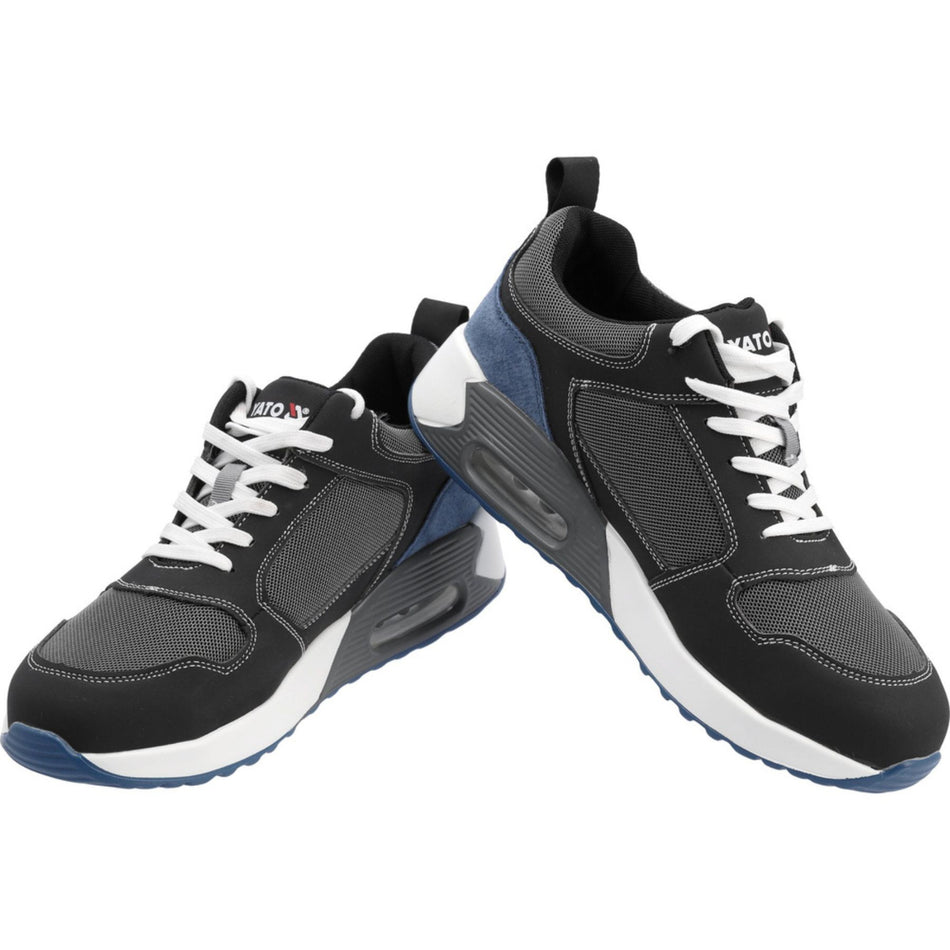 Black and gray sneakers with white laces on a white background