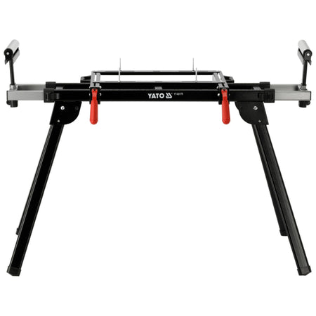 Black metal workbench with red clamps on a white background, featuring YATO branding.