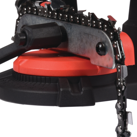 Close-up of a chainsaw with a red handle on a white background